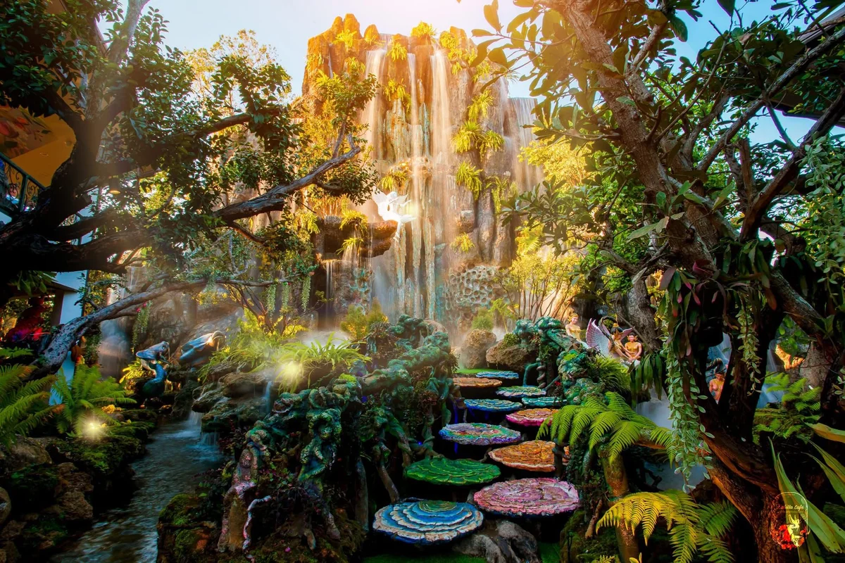 Lalita Cafe enchanted garden with waterfall and colorful stepping stones