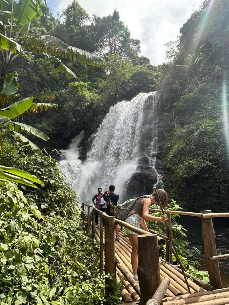 Customer at waterfall with bamboo platform