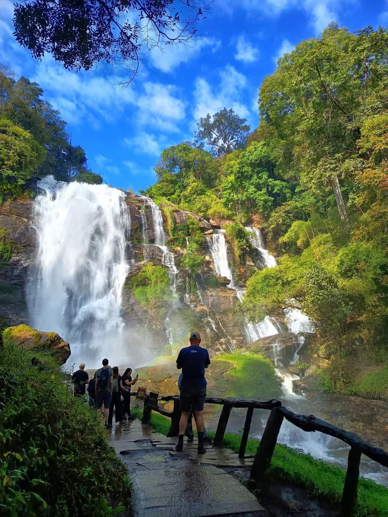 Tour group viewing spectacular waterfall